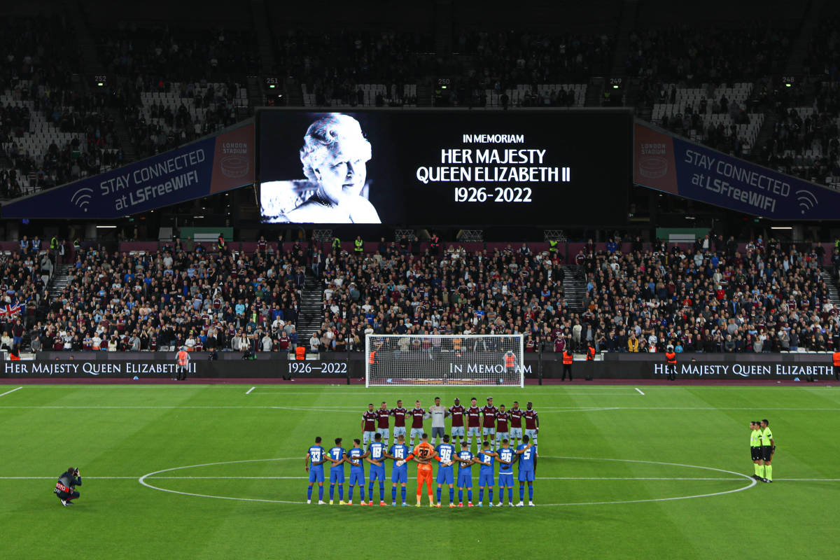 Players from West Ham and FCSB pictured observing a minute's silence following the death of Queen Elizabeth II in September 2022