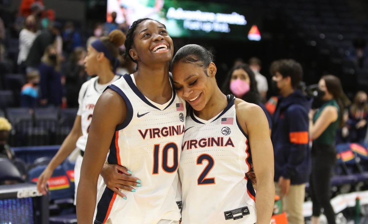 Mir McLean and Taylor Valladay embrace after the UVA women's basketball team's victory over Pittsburgh.