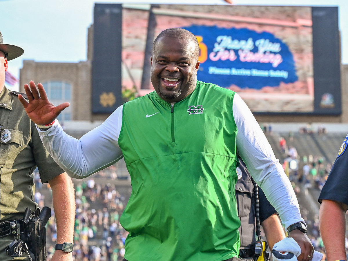 Marshall coach Charles Huff celebrates after beating Notre Dame