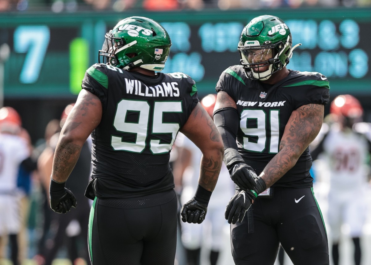 Oct 31, 2021; East Rutherford, New Jersey, USA; New York Jets defensive tackle Quinnen Williams (95) and New York Jets defensive end John Franklin-Myers (91) celebrates a defensive stop against the Cincinnati Bengals during the first half at MetLife Stadium. Mandatory Credit: Vincent Carchietta-USA TODAY Sports