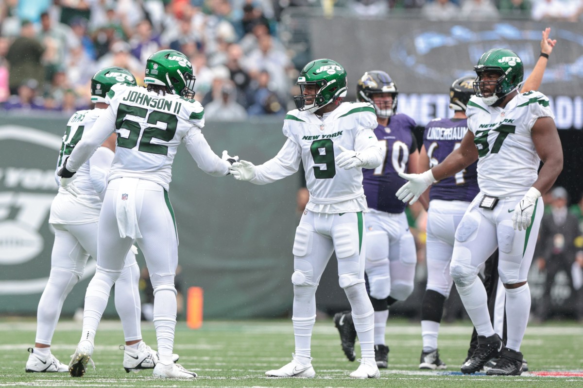Sep 11, 2022; East Rutherford, New Jersey, USA; New York Jets defensive end Jermaine Johnson (52) celebrates a defensive stop with teammates during the first half against the Baltimore Ravens at MetLife Stadium. Mandatory Credit: Vincent Carchietta-USA TODAY Sports