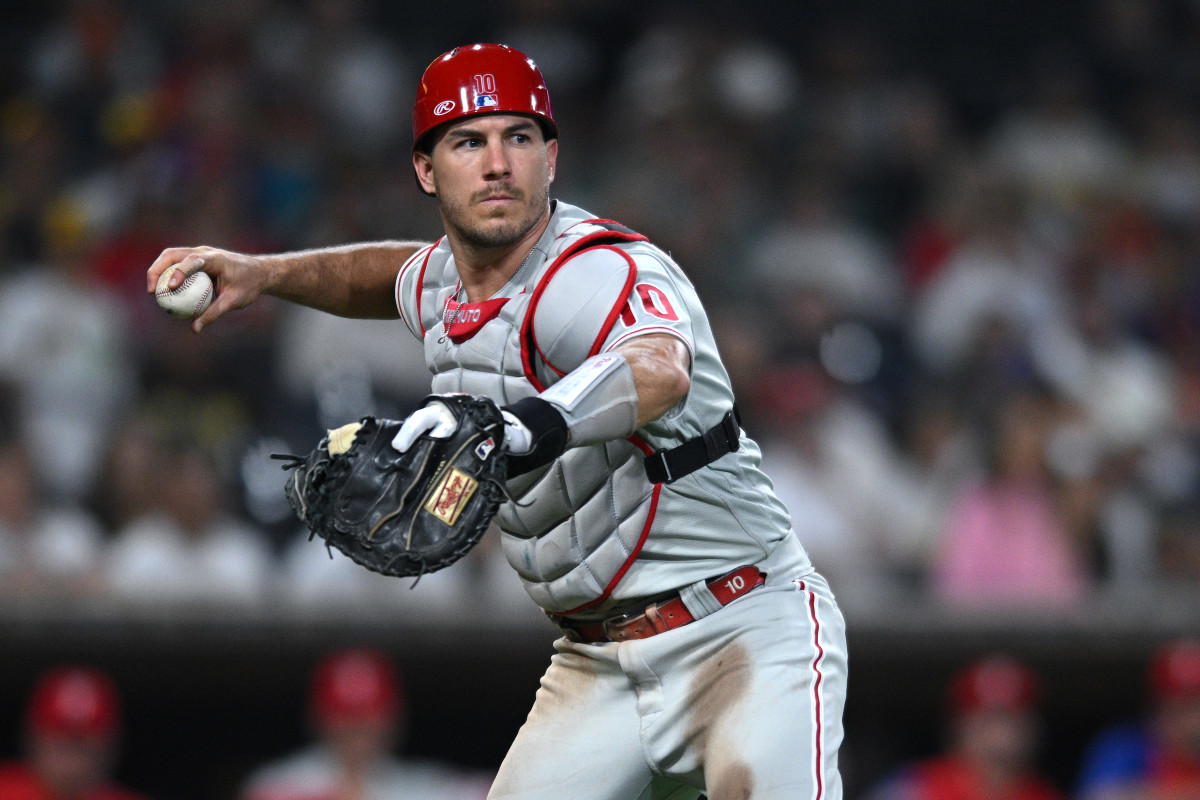 Realmuto sets a throw to first to record the out.