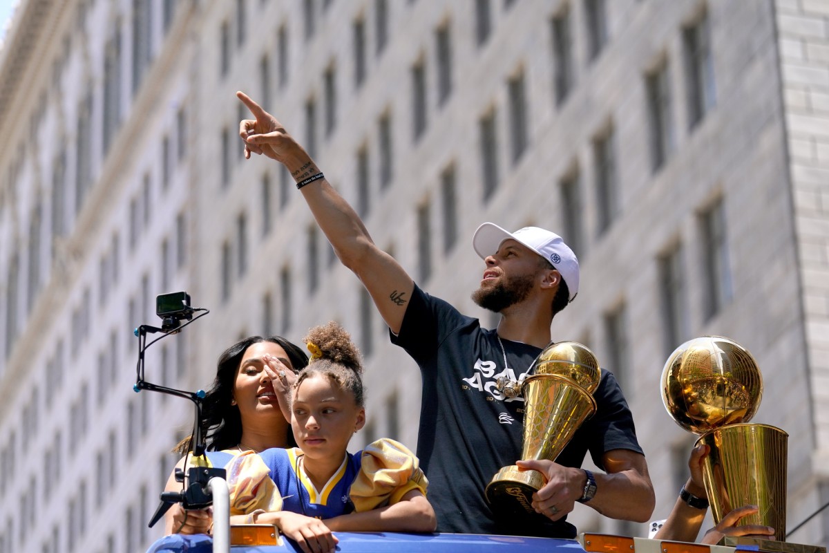 Jun 20, 2022; San Francisco, CA, USA; Golden State Warriors guard Stephen Curry points to fans during the Warriors championship parade in downtown San Francisco. Mandatory Credit: Cary Edmondson-USA TODAY Sports