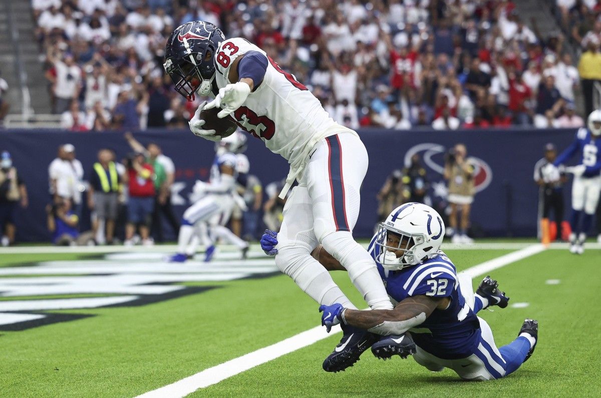 Houston Texans tight end O.J. Howard (83) scores a touchdown after a reception as Indianapolis Colts safety Julian Blackmon (32) attempts to make a tackle during the third quarter at NRG Stadium.
