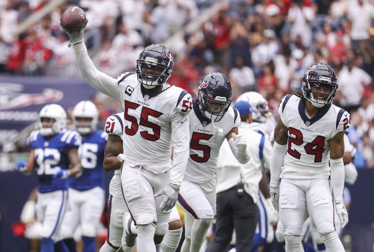 Houston Texans defensive end Jerry Hughes (55) celebrates after an interception during the second quarter against the Indianapolis Colts at NRG Stadium.