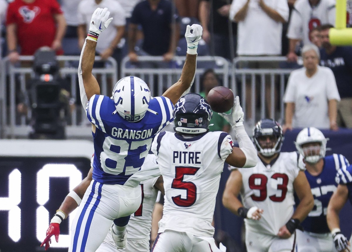 Houston Texans safety Jalen Pitre (5) attempts to intercept a pass intended for Indianapolis Colts tight end Kylen Granson (83) during the fourth quarter at NRG Stadium.