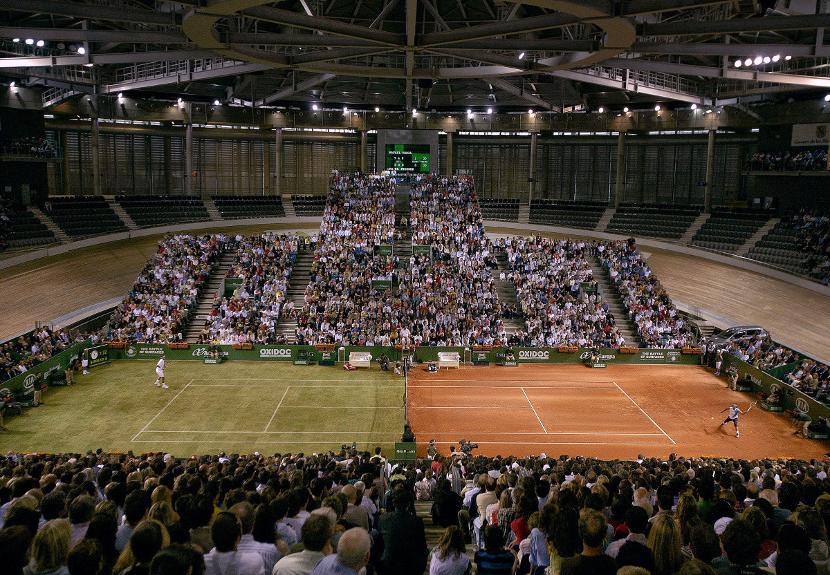 Aerial view of Rafael Nadal and Roger Federer playing in The Battle of Surfaces exhibition match on a grass-clay hybrid court at Palma Arena in Majorca, Spain.