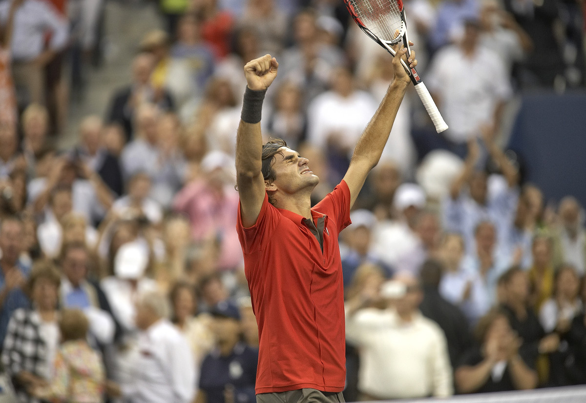 Roger Federer celebrates his win against Andy Murray in the 2008 U.S. Open final.