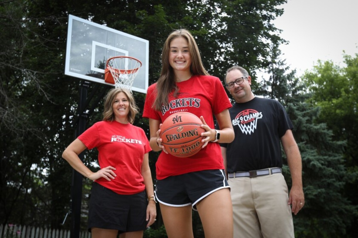 Lilly Meister poses with her parents Kurt and Angie.