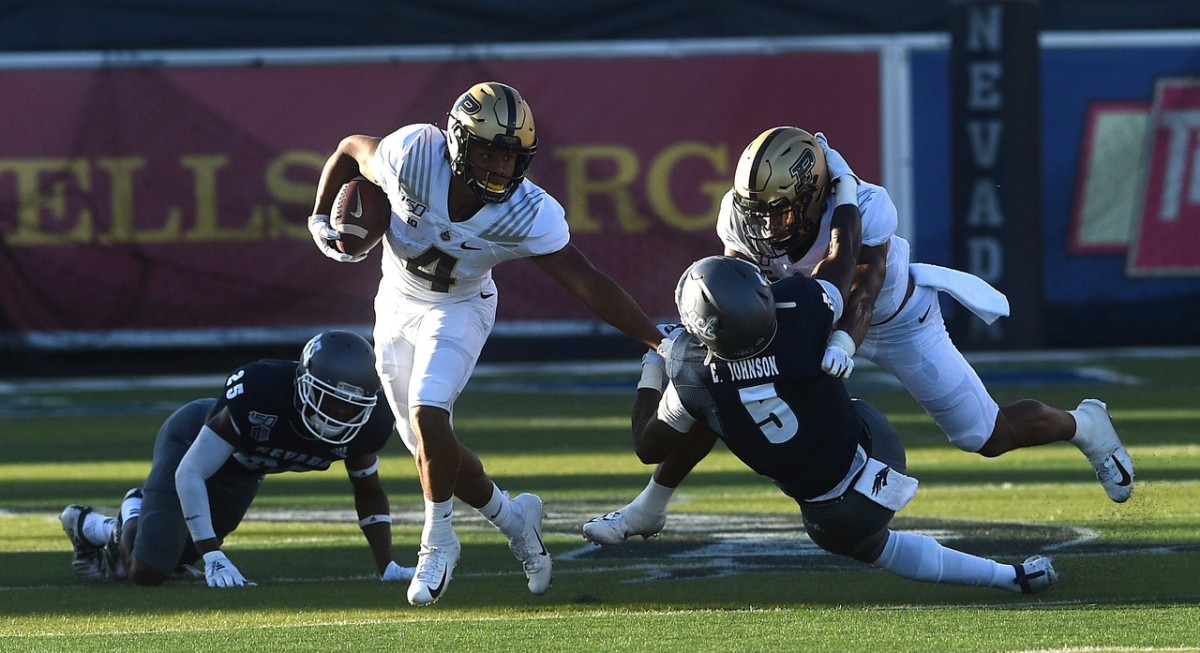 Purdue's Rondale Moore (4) looks to run while taking on Nevada during their football game at Mackay Stadium in Reno on Aug. 30, 2019.