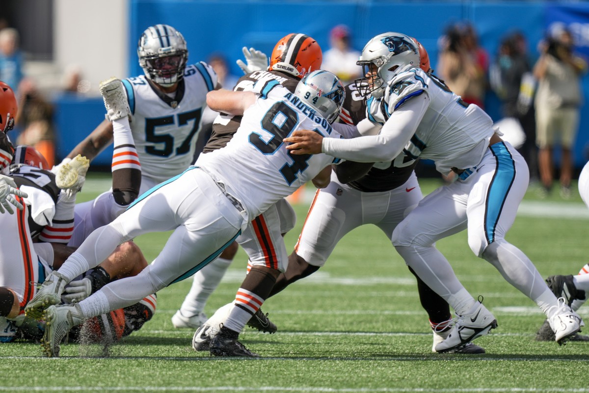 Sep 11, 2022; Charlotte, North Carolina, USA; Carolina Panthers defensive end Henry Anderson (94) tackles Cleveland Browns running back Nick Chubb (24) during the second half at Bank of America Stadium.