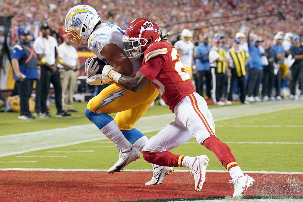 ep 15, 2022; Kansas City, Missouri, USA; Los Angeles Chargers fullback Zander Horvath (40) catches a touchdown pass against Kansas City Chiefs safety Justin Reid (20) during the first half at GEHA Field at Arrowhead Stadium.