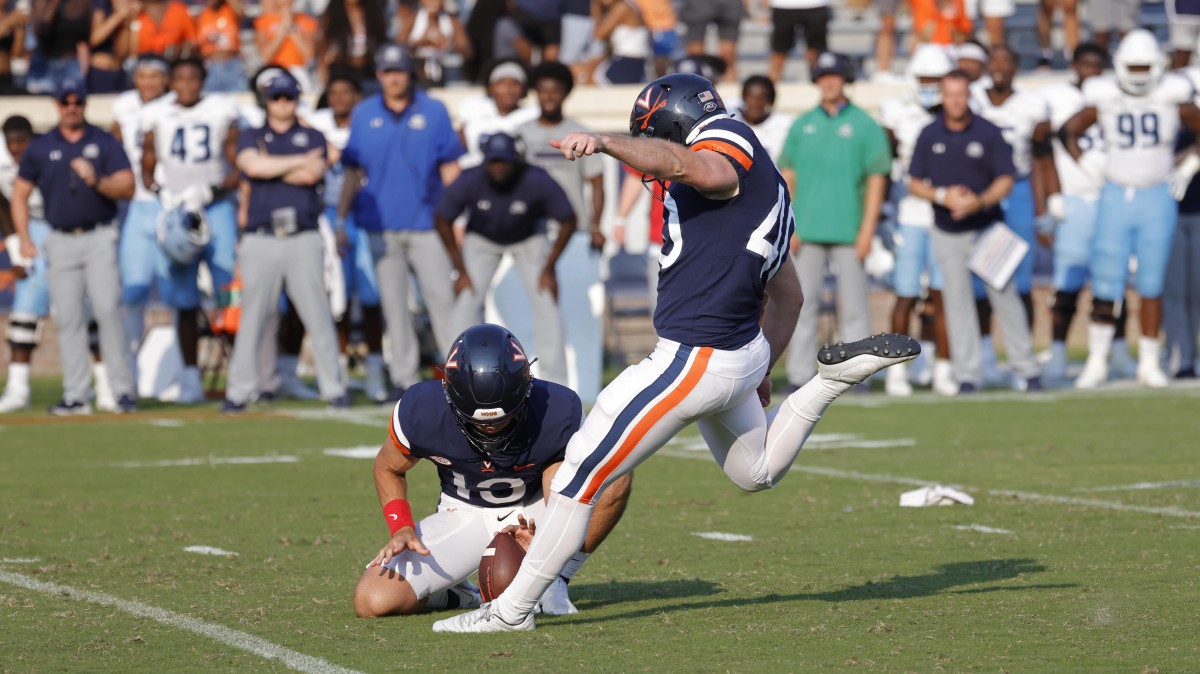 Virginia Cavaliers punter Brendan Farrell (40) kicks the game-winning field goal on the final play of the game against the Old Dominion Monarchs during the fourth quarter at Scott Stadium.