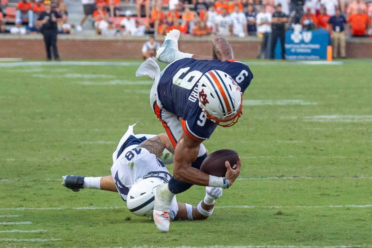 Robby Ashford is tackled against Penn State.