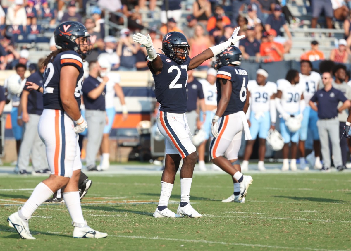 Virginia safety Lex Long celebrates after successfully defending an Old Dominion passing play.