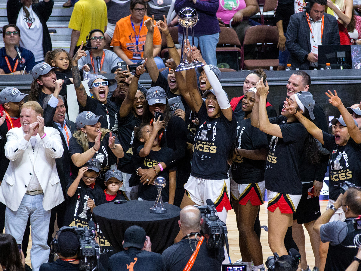 Las Vegas Aces celebrate after defeating the Connecticut Sun and winning the 2022 WNBA championship.