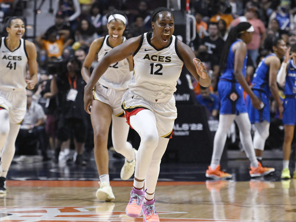 Chelsea Gray celebrates as the Las Vegas Aces win the 2022 WNBA championship.