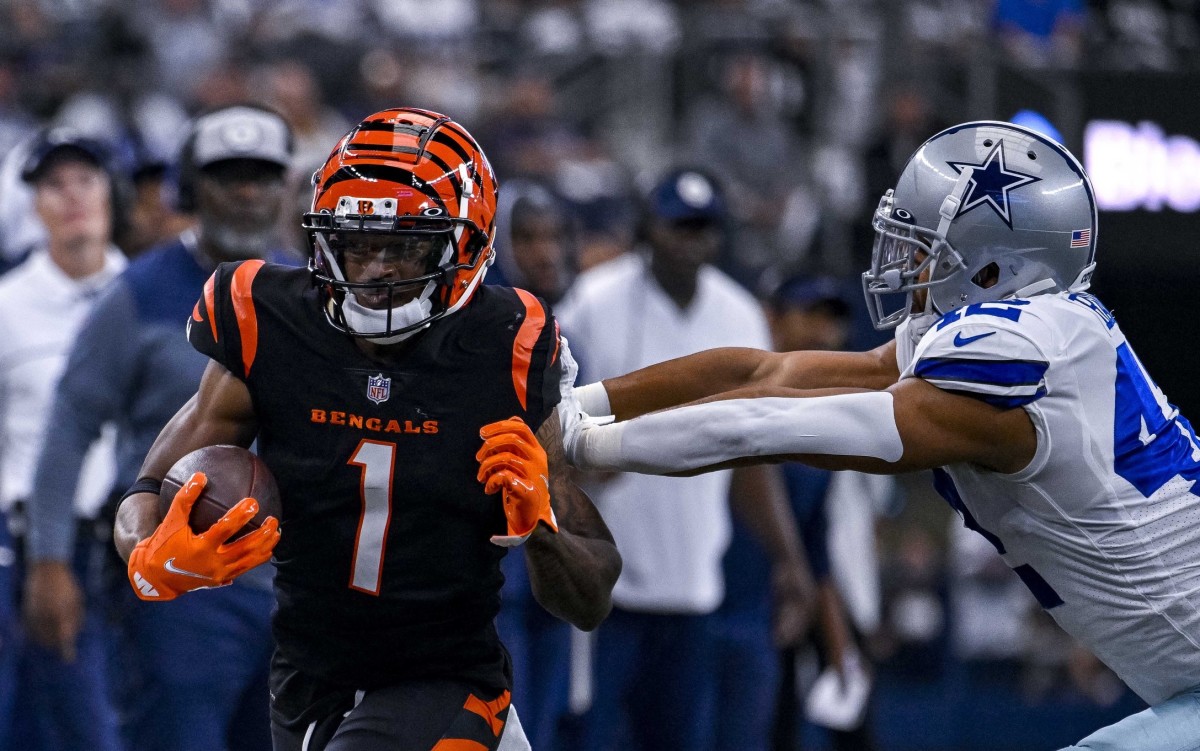 Sep 18, 2022; Arlington, Texas, USA; Cincinnati Bengals wide receiver Ja'Marr Chase (1) is pushed out of bounds by Dallas Cowboys linebacker Anthony Barr (42) during the first quarter at AT&T Stadium. Mandatory Credit: Jerome Miron-USA TODAY Sports