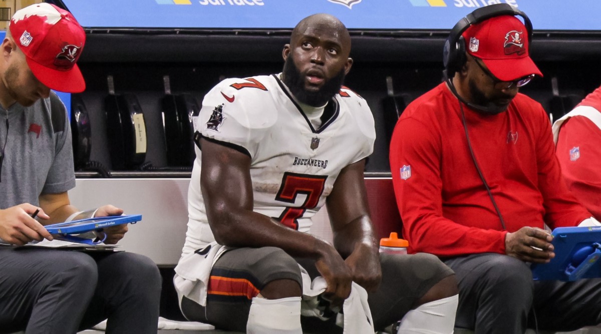 Buccaneers running back Leonard Fournette (7) looks on from the bench during the second half of a game against the Saints.