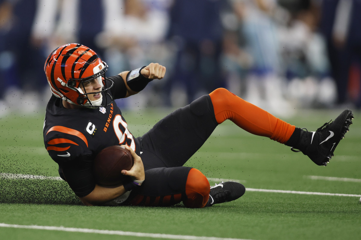 Joe Burrow slides down during a Bengals loss to the Cowboys