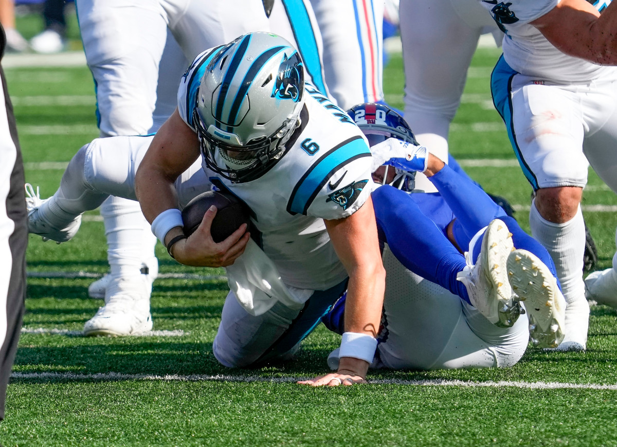 Baker Mayfield is tackled by a Giants defender