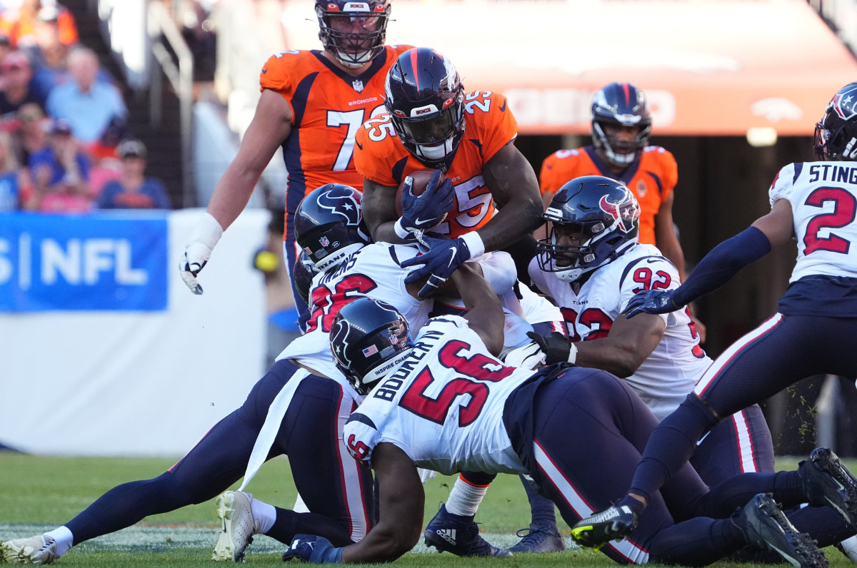 Multiple Texans defenders gang-tackle Broncos running back Melvin Gordon