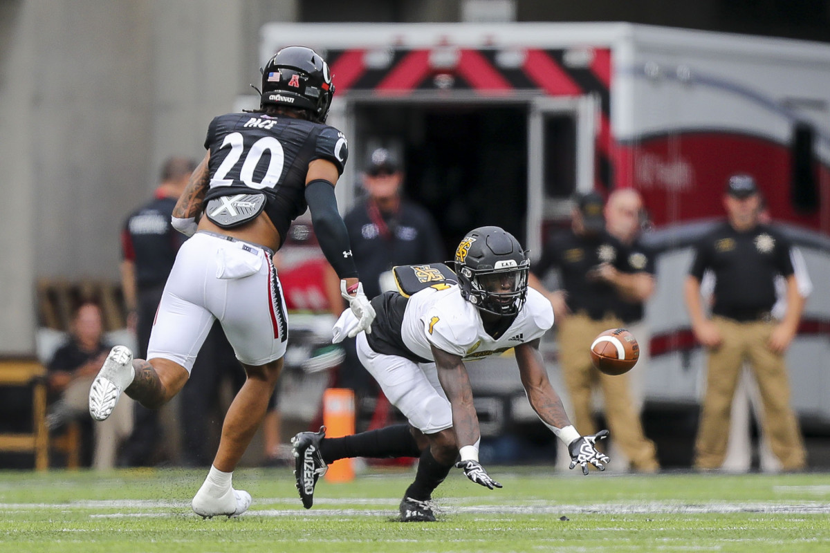Sep 10, 2022; Cincinnati, Ohio, USA; Kennesaw State Owls running back Iaan Cousin (1) catches a pass against Cincinnati Bearcats linebacker Deshawn Pace (20) in the first half at Nippert Stadium. Mandatory Credit: Katie Stratman-USA TODAY Sports