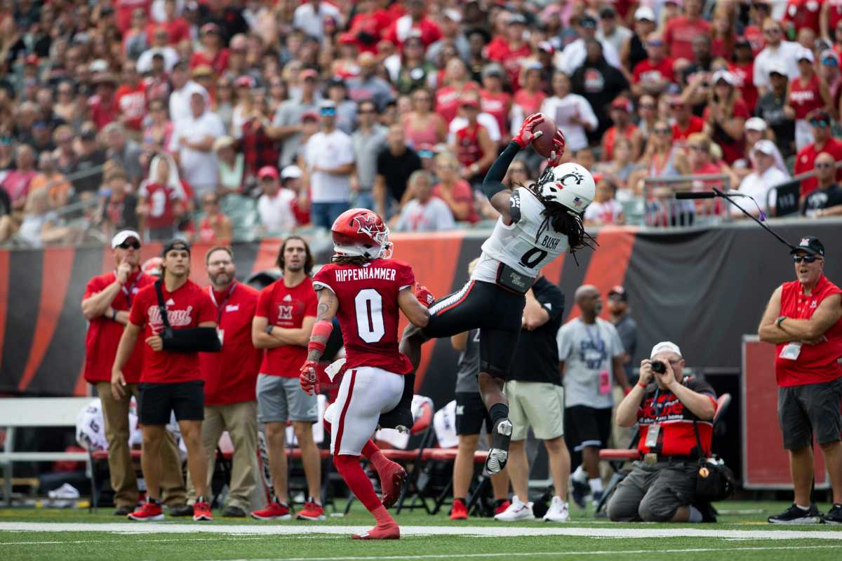 Cincinnati Bearcats cornerback Arquon Bush (9) catches an interception during the second quarter of the NCAA football game between the Cincinnati Bearcats and the Miami RedHawks at Paycor Stadium in Cincinnati on Saturday, Sept. 17, 2022. The Cincinnati Bearcats defeated the Miami (Oh) Redhawks 38-17 in the 126th Battle for the Victory Bell. Cincinnati Bearcats Football Vs Miami Redhawks Sept 17 2022
