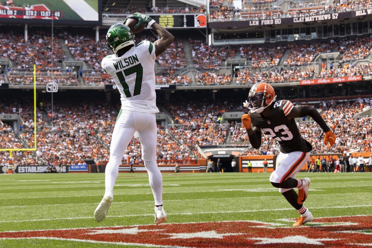 Sep 18, 2022; Cleveland, Ohio, USA; New York Jets wide receiver Garrett Wilson (17) makes a touchdown reception against Cleveland Browns cornerback Martin Emerson Jr. (23) during the second quarter at FirstEnergy Stadium. Mandatory Credit: Scott Galvin-USA TODAY Sports