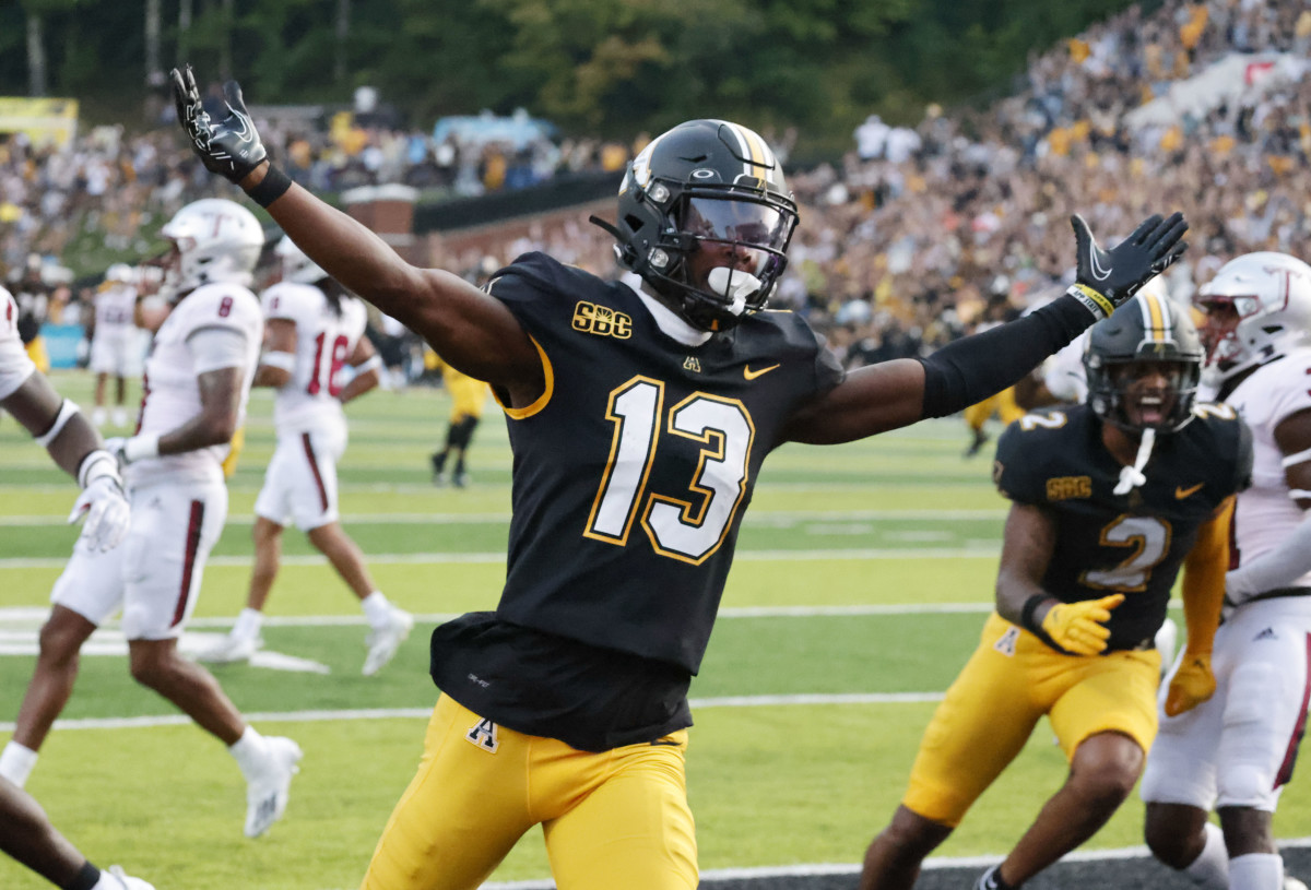Appalachian State Mountaineers wide receiver Christan Horn (13) celebrates a touchdown in the closing seconds as against the Troy Trojans during the second half at Kidd Brewer Stadium.