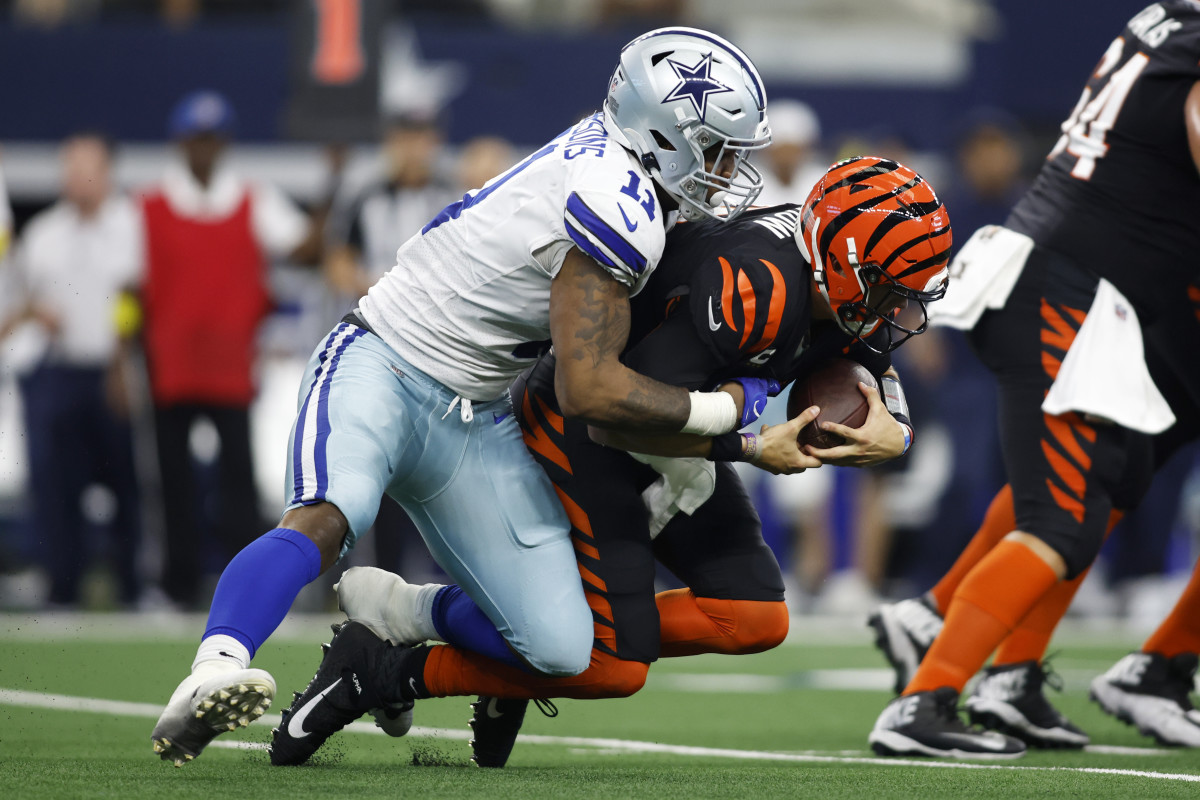 Dallas Cowboys linebacker Micah Parsons (11) sacks Cincinnati Bengals quarterback Joe Burrow (9) in the third quarter at AT&T Stadium.