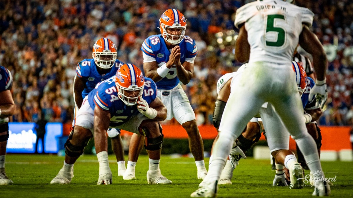 Former Florida OL O'Cyrus Torrence (54) lines up pre-snap against USF during the 2022 season.