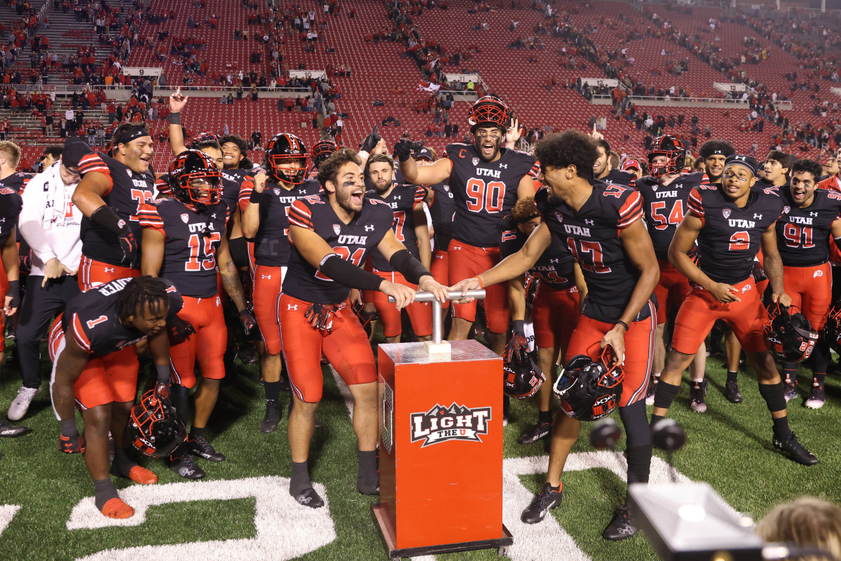 Utah Utes linebacker Karene Reid (21) and Utah Utes wide receiver Devaughn Vele (17) light the block U after a victory against the San Diego State Aztecs at Rice-Eccles Stadium.