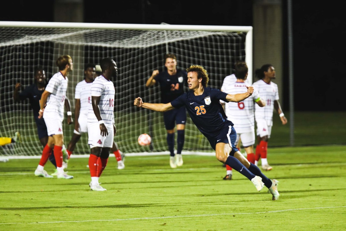 Virginia Cavaliers men's soccer freshman forward Andy Sullins celebrates after scoring his first-career goal.