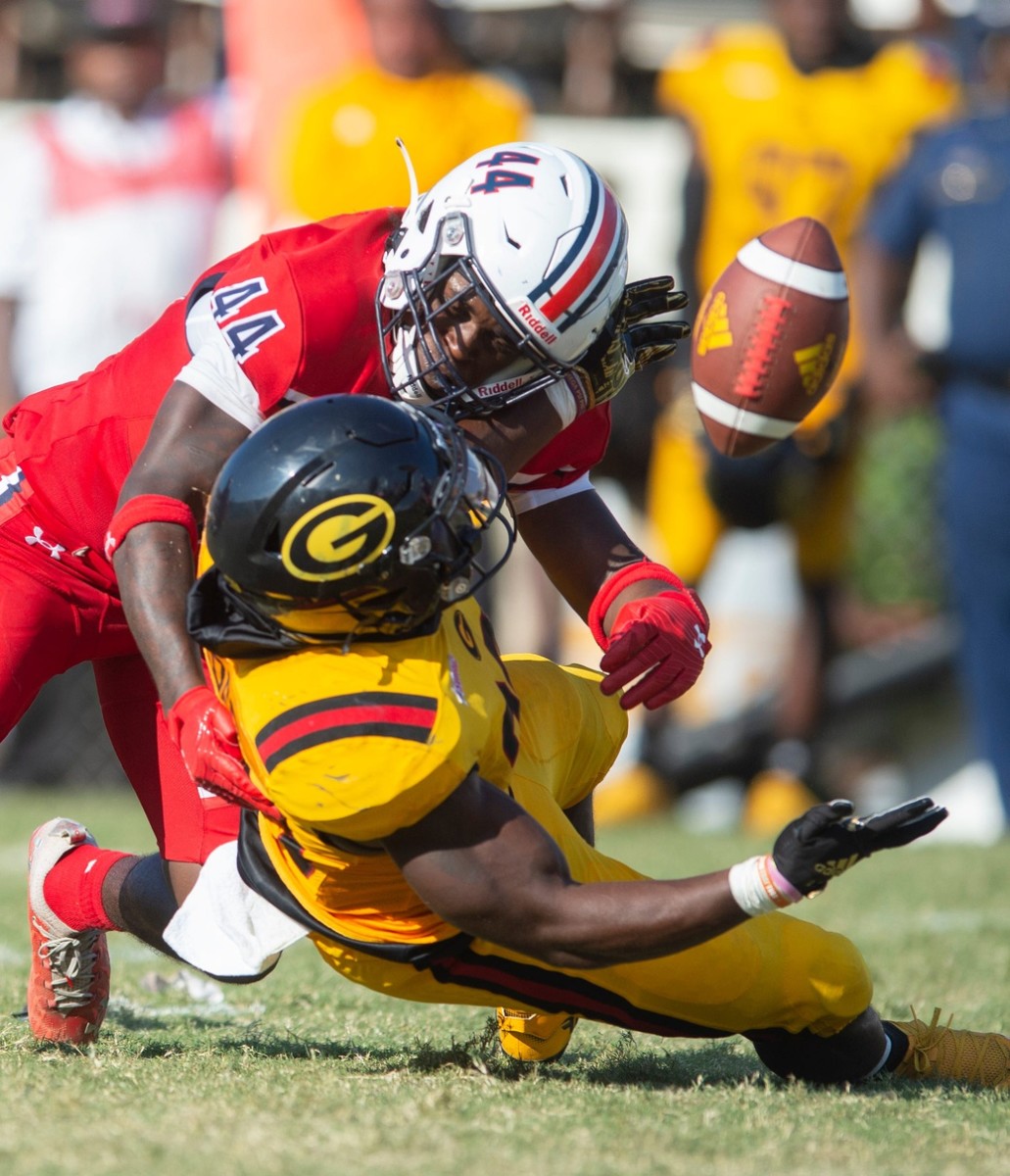 Jackson State linebacker Daelyn Dunn (44) causes Grambling running back Keilon Elder (23) to fumble during the second half of an NCAA college football game in Jackson, Miss., Saturday, Sept. 17, 2022. Jackson State won 66-24. Tcl Grambling Jackson State