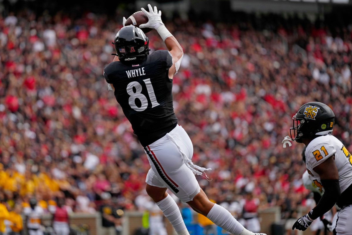 Cincinnati Bearcats tight end Josh Whyle (81) makes a leaping catch in the end zone for a touchdown in the first quarter of the NCAA football game between the Cincinnati Bearcats and the Kennesaw State Owls at Nippert Stadium in Cincinnati on Saturday, Sept. 10, 2022.
