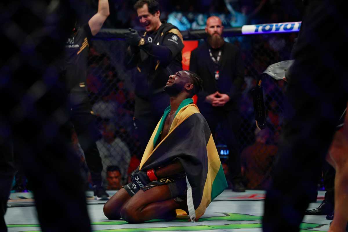 Aljamain Sterling reacts to winning the bantamweight title belt by split decision against Petr Yan, not shown, Saturday, April 9, 2022 during UFC 273.