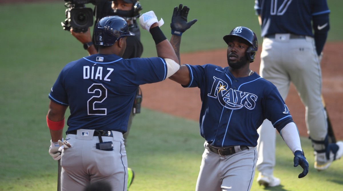 Tampa Bay left fielder Randy Arozarena (56) celebrates with first baseman Yandy Diaz (2) after hitting a solo home run in the 2020 ALCS at Petco Park in San Diego, Calif. (Orlando Ramirez-USA TODAY Sports)