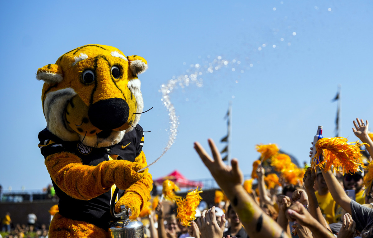 Sep 17, 2022; Columbia, Missouri, USA; Missouri Tigers mascot Truman the Tiger sprays water on the student section prior to a game against the Abilene Christian Wildcats at Faurot Field at Memorial Stadium. Mandatory Credit: Jay Biggerstaff-USA TODAY Sports