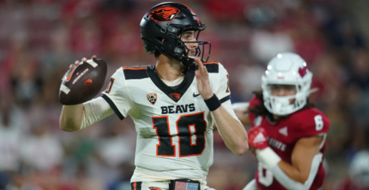 Oregon State Beavers quarterback Chance Nolan attempts a pass during a college football game.