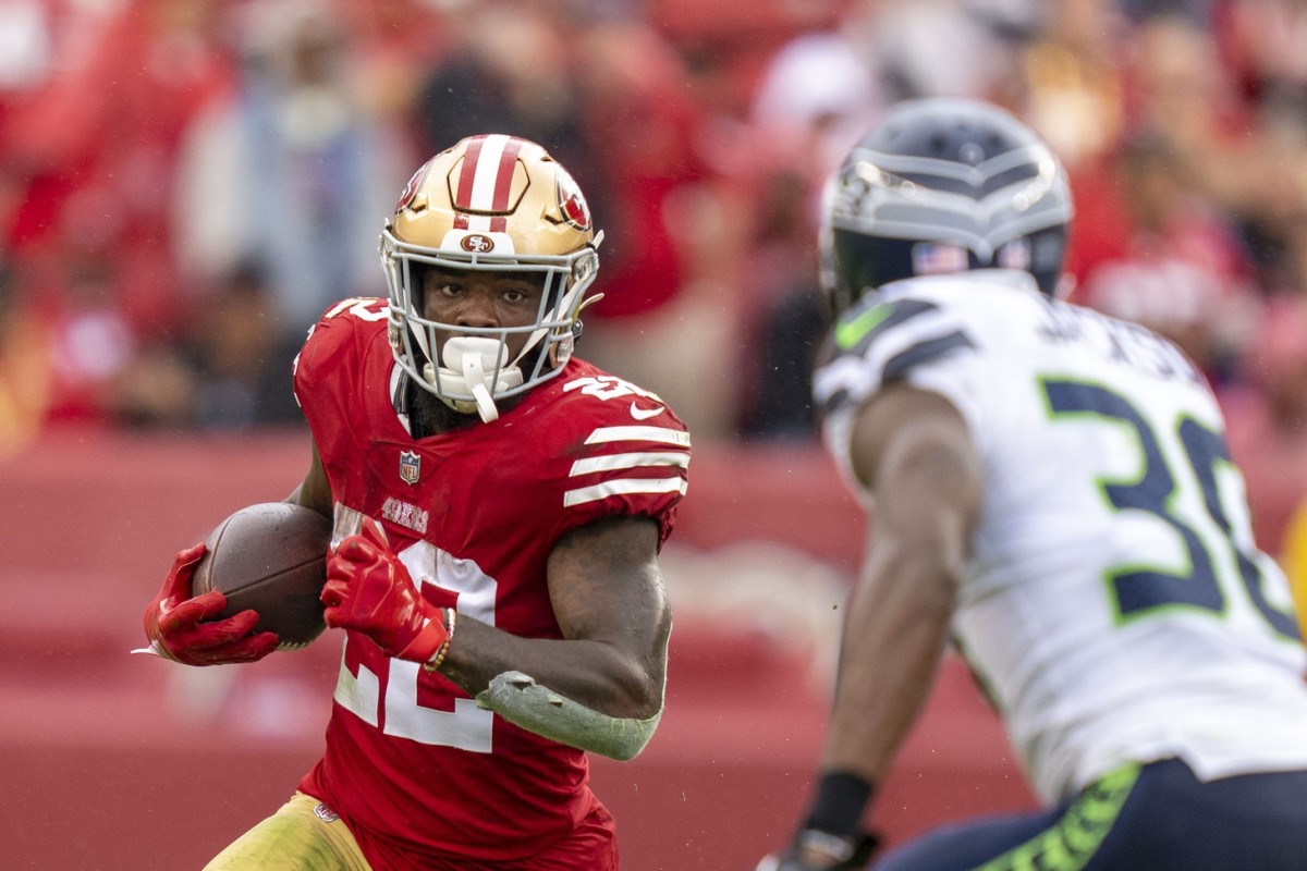 San Francisco 49ers running back Jeff Wilson Jr. (22) runs with the football against Seattle Seahawks cornerback Mike Jackson (30) during the fourth quarter at Levi's Stadium.