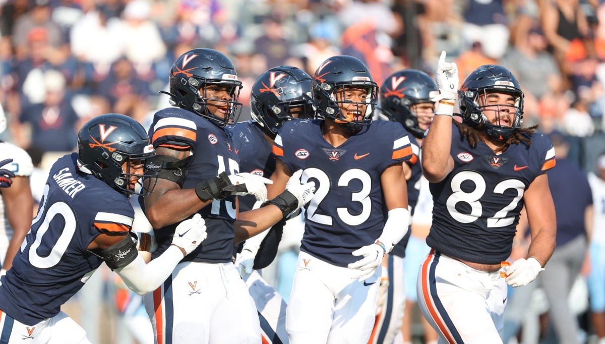 The Virginia defense celebrates after making a stop against Old Dominion.