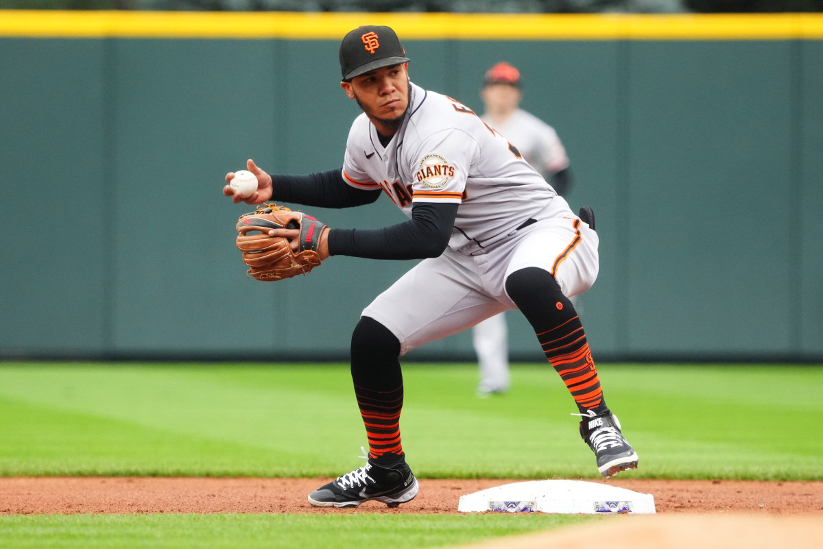 SF Giants infielder Thairo Estrada touches second base in a game against the Rockies on September 22, 2022.