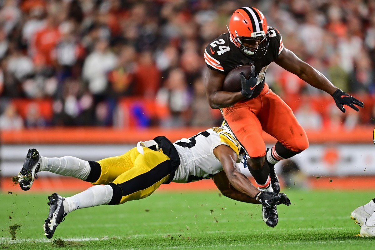 Sep 22, 2022; Cleveland, Ohio, USA; Cleveland Browns running back Nick Chubb (24) hurdles over Pittsburgh Steelers safety Damontae Kazee (24) during the first quarter at FirstEnergy Stadium. Mandatory Credit: David Dermer-USA TODAY Sports