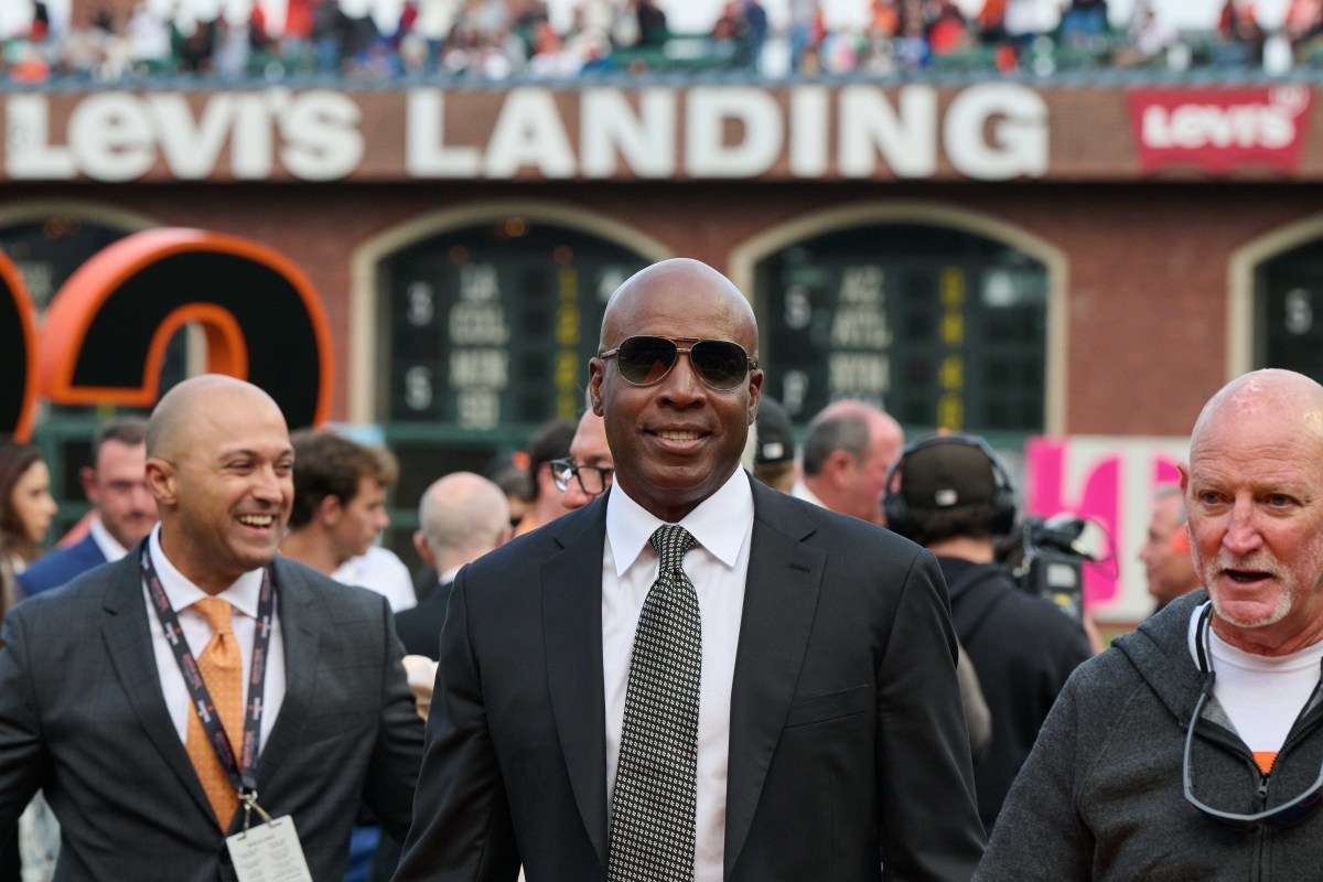 SF Giants consultant Barry Bonds looks into the camera in front of a group of people at Oracle Park during Will Clark's number retirement ceremony. (2022)