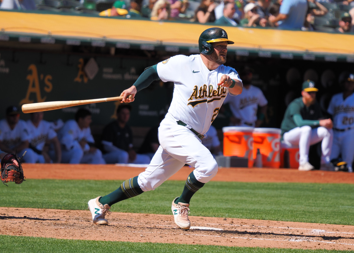 Oakland Athletics first baseman Stephen Vogt (21) hits a three run RBI triple against the Seattle Mariners. (2022)