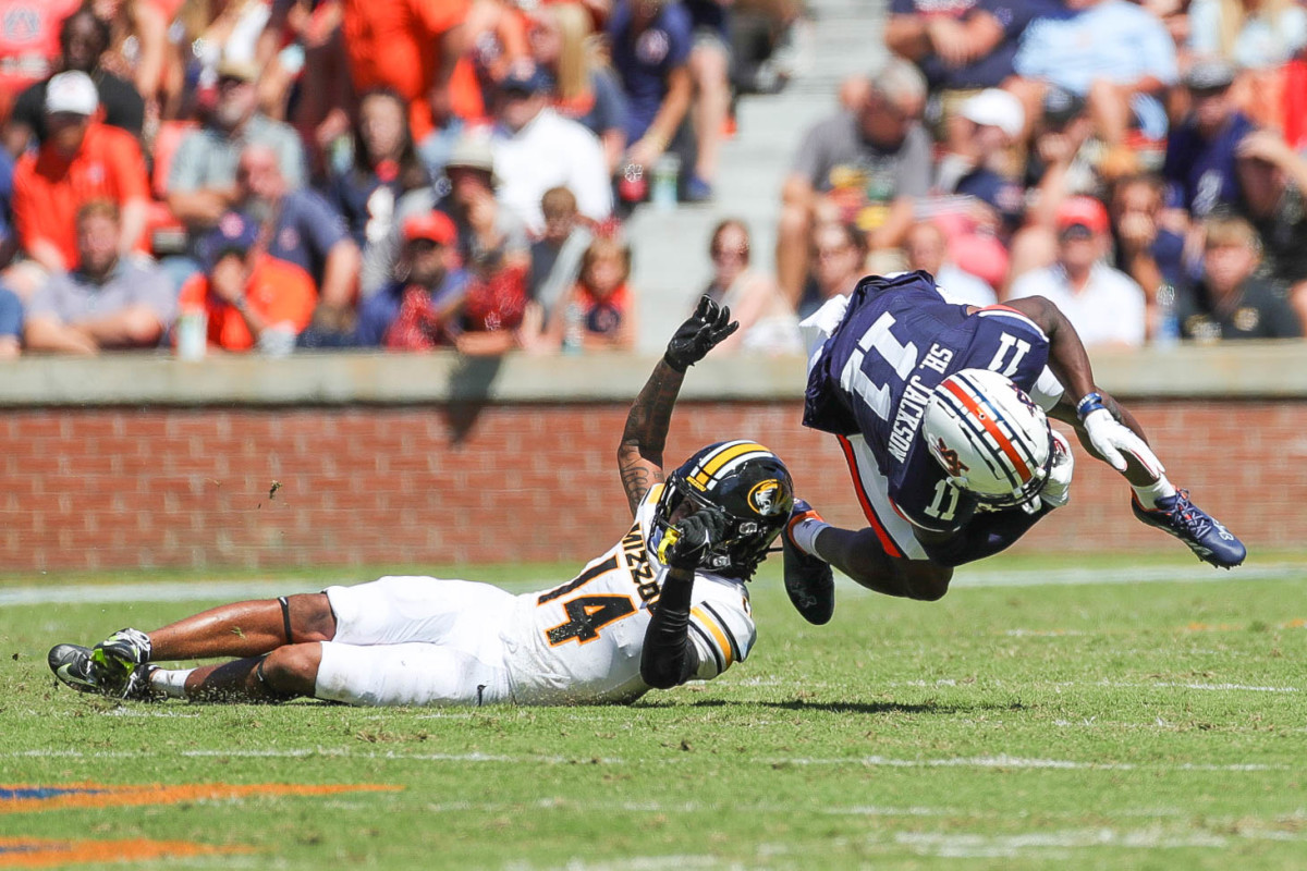 Auburn Tigers wide receiver Shedrick Jackson (11) gets upended by Missouri Tigers defensive back Kris Abrams-Draine (14) during the game between the Missouri Tigers and the Auburn Tigers at Jordan-Hare Stadium on Sept. 24, 2022.