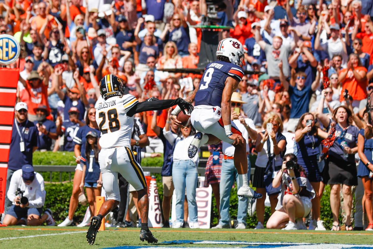 Auburn Tigers quarterback Robby Ashford (9) jumps over the goal line with his first quarter score during the game between the Missouri Tigers and the Auburn Tigers at Jordan-Hare Stadium on Sept. 24, 2022.