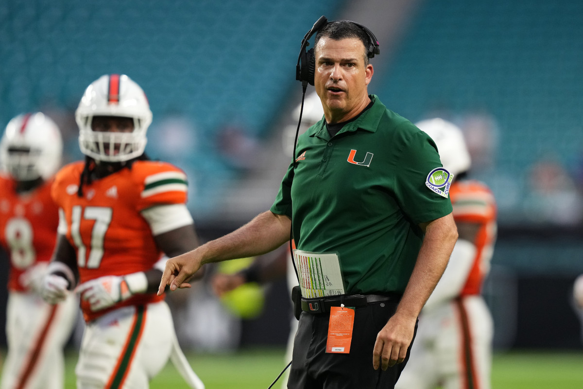 Miami Hurricanes head coach Mario Cristobal walks onto the field during the second half against the Middle Tennessee Blue Raiders at Hard Rock Stadium.