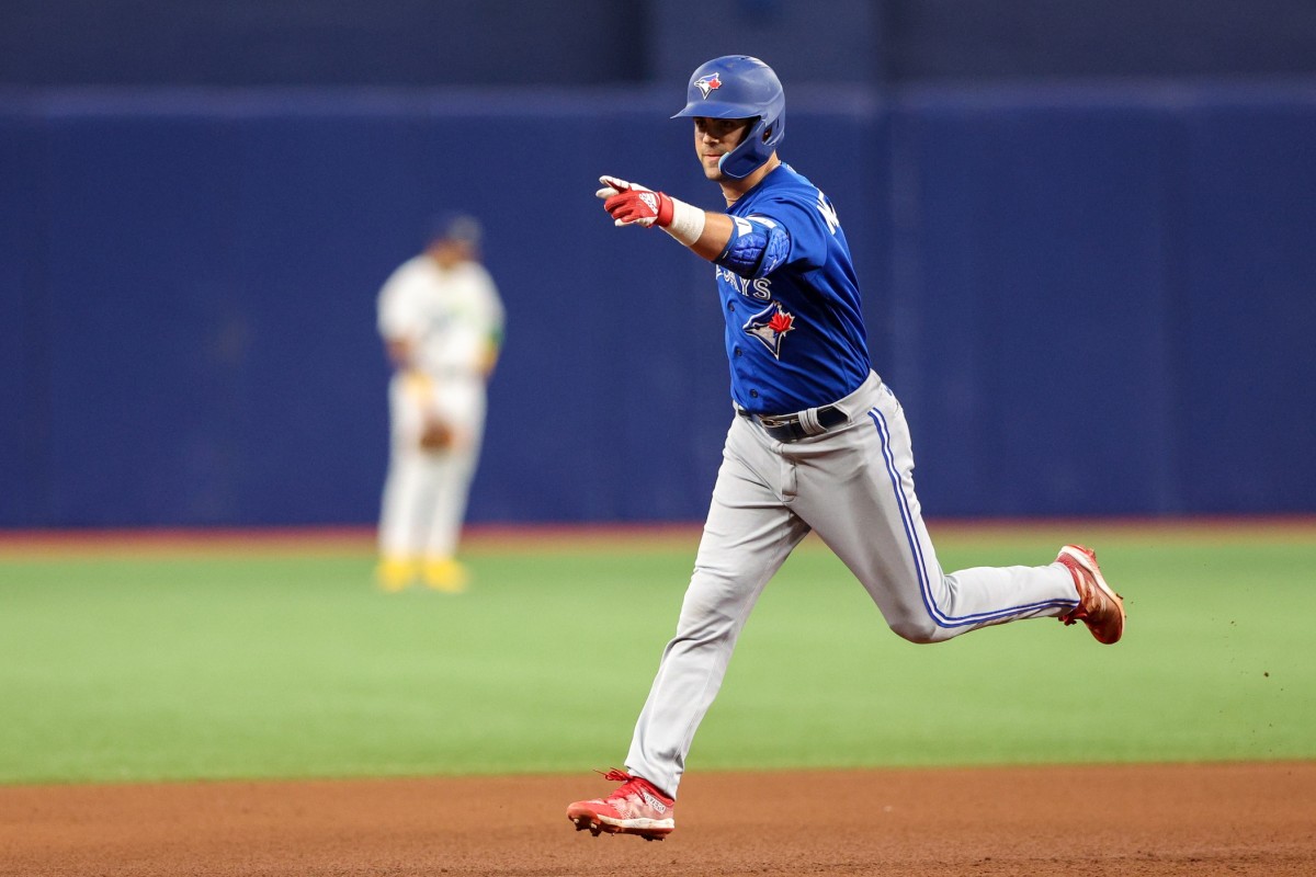 Toronto's Whit Merrifeld trots around the bases after his three-run homer on Saturday night. (USA TODAY Sports)